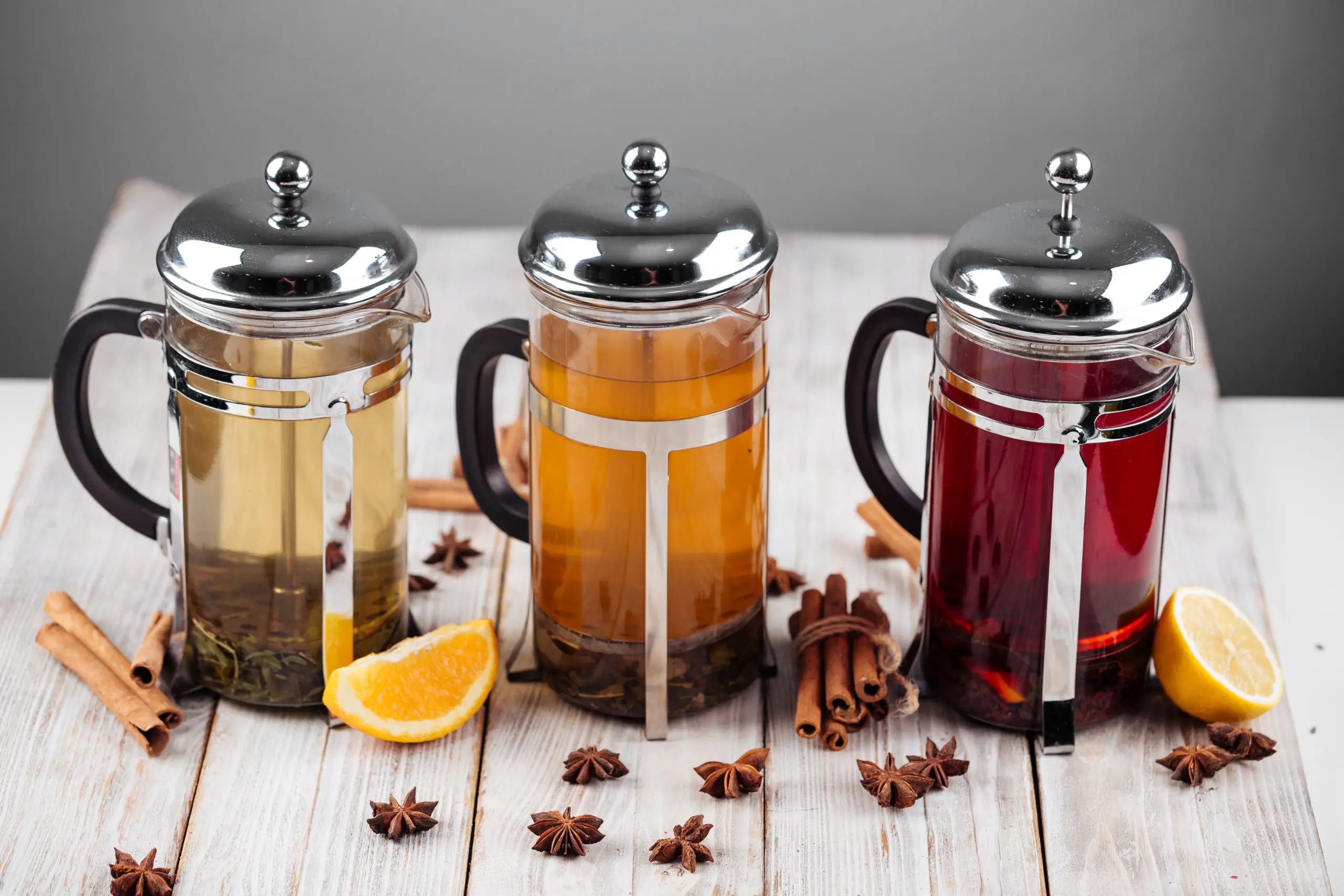 Different fruit teas in french press pots