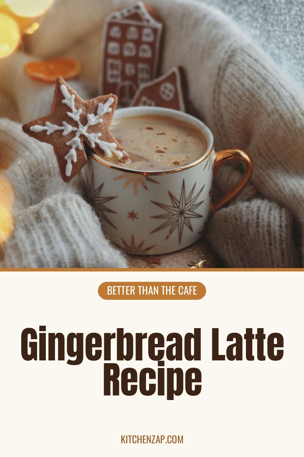 Gingerbread latte in a gold rimmed mug with star cookies and a cozy knit sweater
