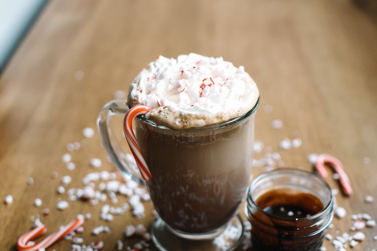 Homemade Peppermint Mocha: Easy Starbucks Copycat 5 Peppermint mocha in a glass mug topped with whipped cream and crushed candy cane